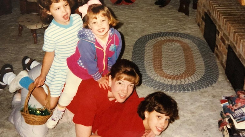 Ashley Graham playing with her sisters and mom