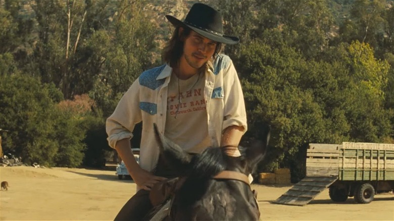 Austin Butler as Tex Watson in OUATIH, on a horse