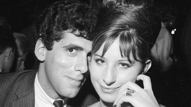 Barbra Streisand touching faces with Elliot Gould