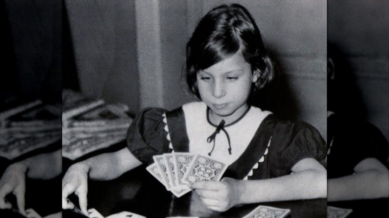 Young Barbra Streisand playing cards