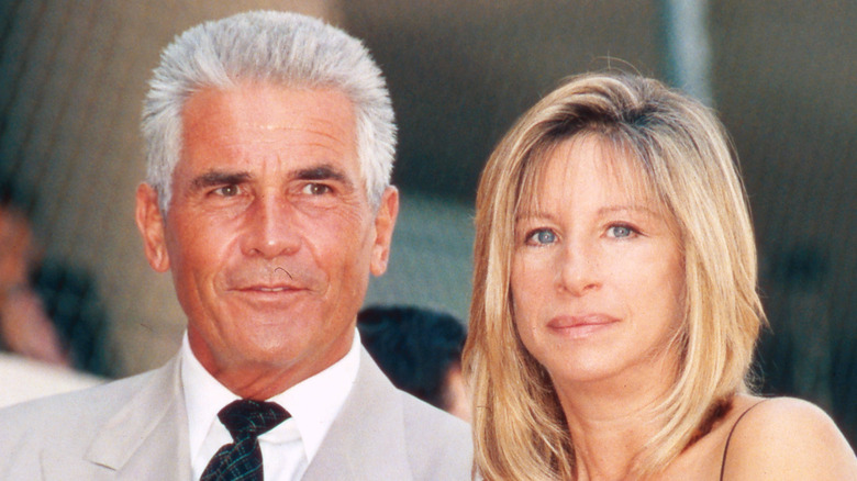 Barbra Streisand next to James Brolin, both posing