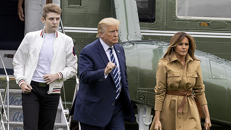 Barron, Donald and Melania Trump walking