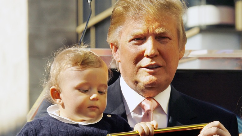 Donald Trump holding Barron