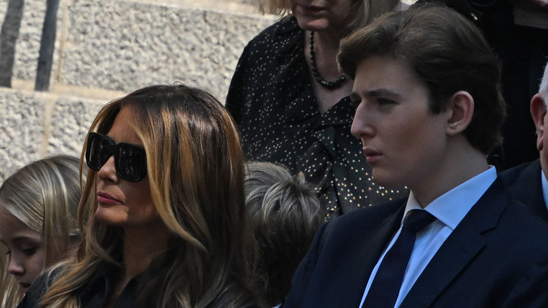 Melania Trump, posing with Barron Trump