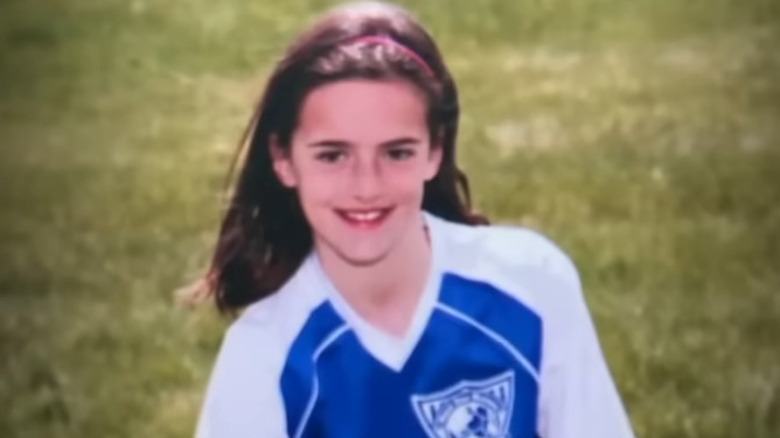 Caitlin Clark smiling in soccer uniform