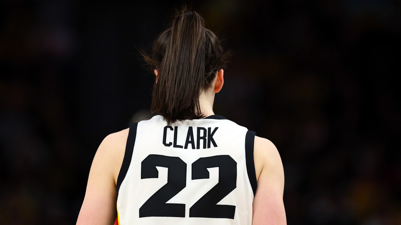 Caitlin Clark turned around, with her 22 jersey