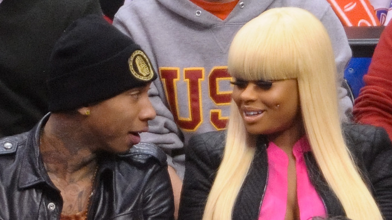 Tyga, Blac Chyna, talking while seated