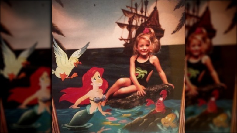 Blake Lively posing with Disney's Ariel as a child