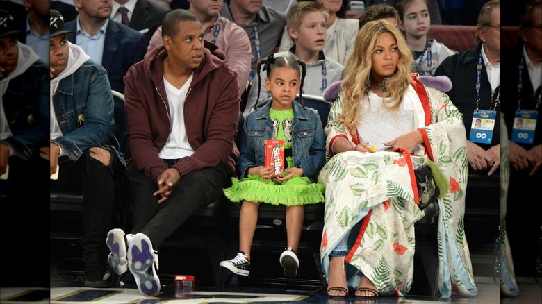 Blue Ivy Carter attends game with her parents