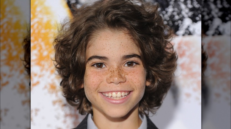 Young Cameron Boyce posing on red carpet