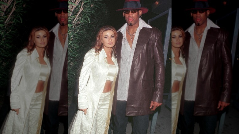 Carmen Electra posing with Dennis Rodman