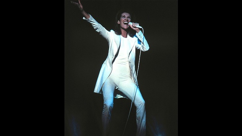 Celine Dion performing wearing all white