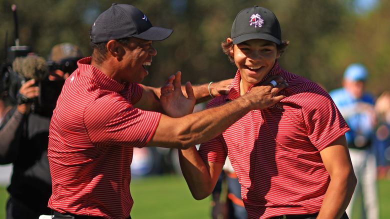 Tiger and Charlie Woods celebrate his first hole-in-one