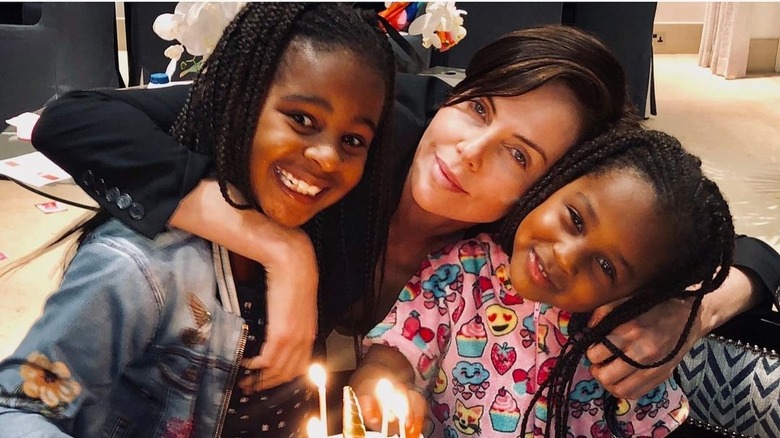 Charlize Theron with her daughters Jackson and August