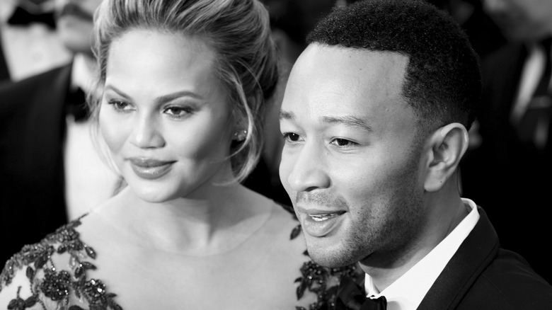 Chrissy Teigen and John Legend posing on red carpet