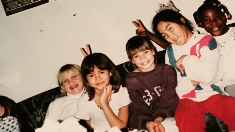 Chrissy Teigen as a child with friends 