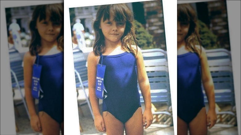 Christina Ricci as a child in a blue swimsuit