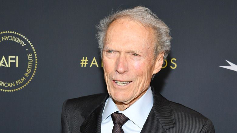 Clint Eastwood poses in a gray suit in 2020.