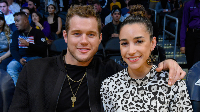 Colton Underwood and Aly Raisman at a basketball game in 2017