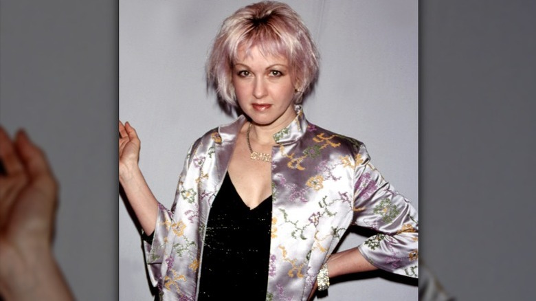 Cyndi Lauper in silk jacket and lilac hair