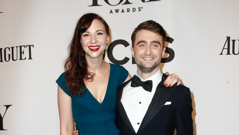 Daniel Radcliffe and Erin Darke pose side by side.