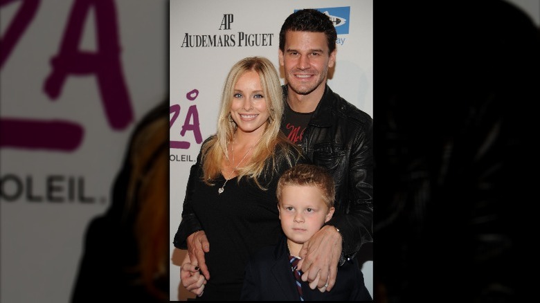 David Boreanaz smiling with pregnant wife and son