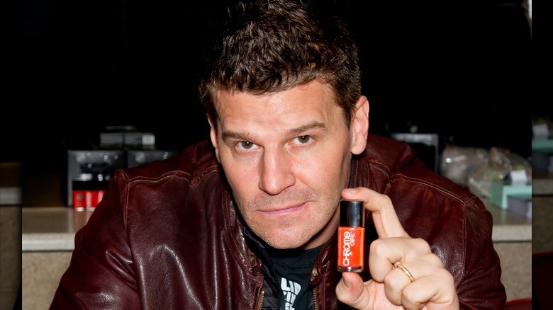 David Boreanaz holding Chrome Girl nail polish bottle