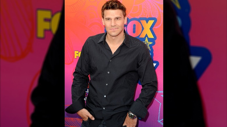 David Boreanaz smirking in black shirt