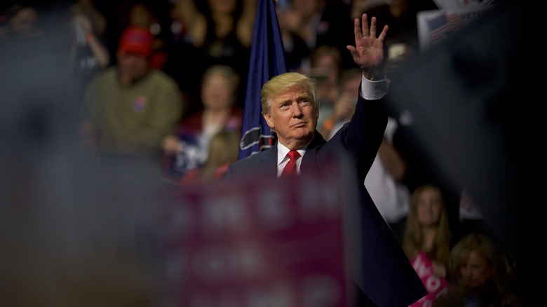 Donald Trump waving at a rally