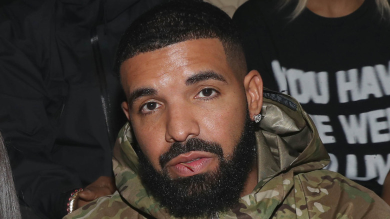 Drake gazing in front at Fashion Week