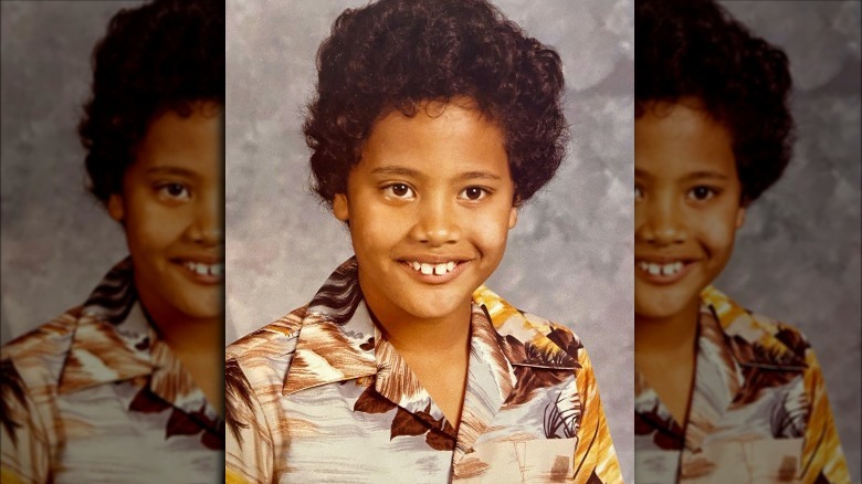 A young Dwayne Johnson smiling