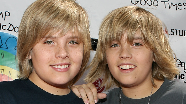 Dylan and Cole Sprouse smile at camera