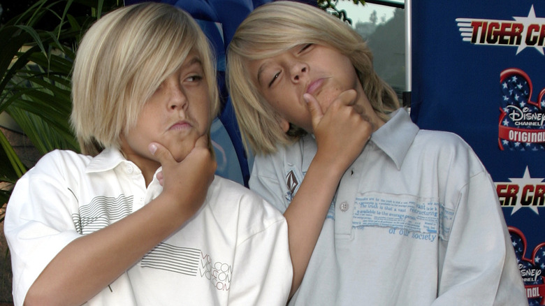 Cole and Dylan Sprouse posing at event