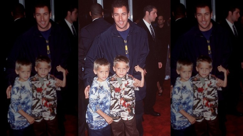 Adam Sandler and the Sprouse twins smiling