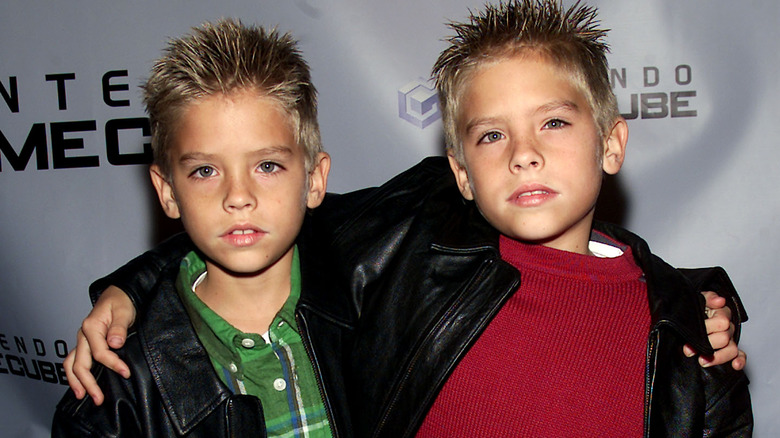 Dylan and Cole Sprouse looking at camera