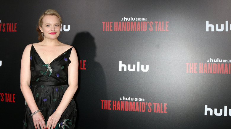 Elisabeth Moss smiling on red carpet for The Handmaid's Tale