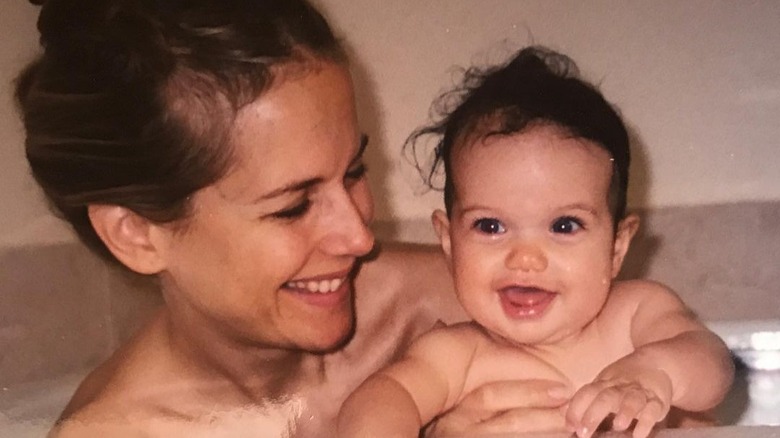 Kelly Preston smiling at baby Ella Bleu Travolta