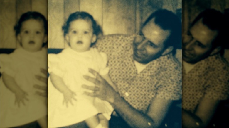 Faith Hill as a baby, held by her dad