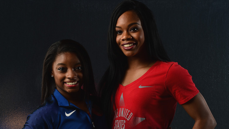 Simone Biles and Gabby Douglas posing together