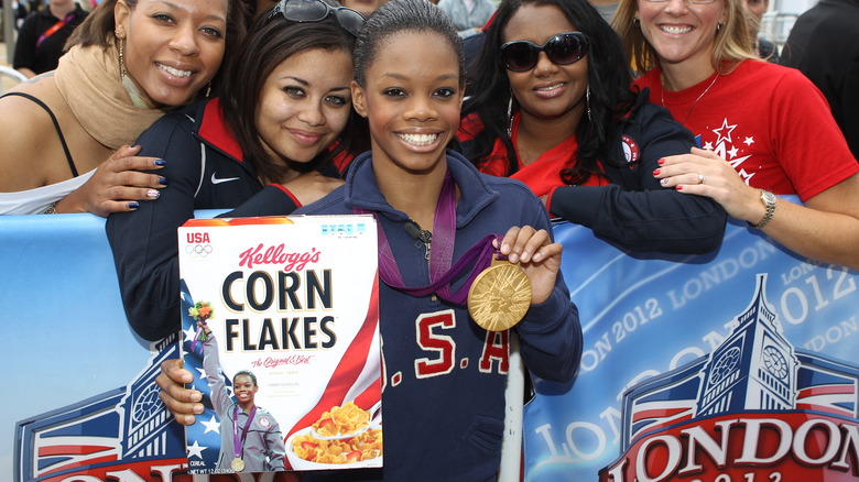 Gabby Douglas smiling with gold medal