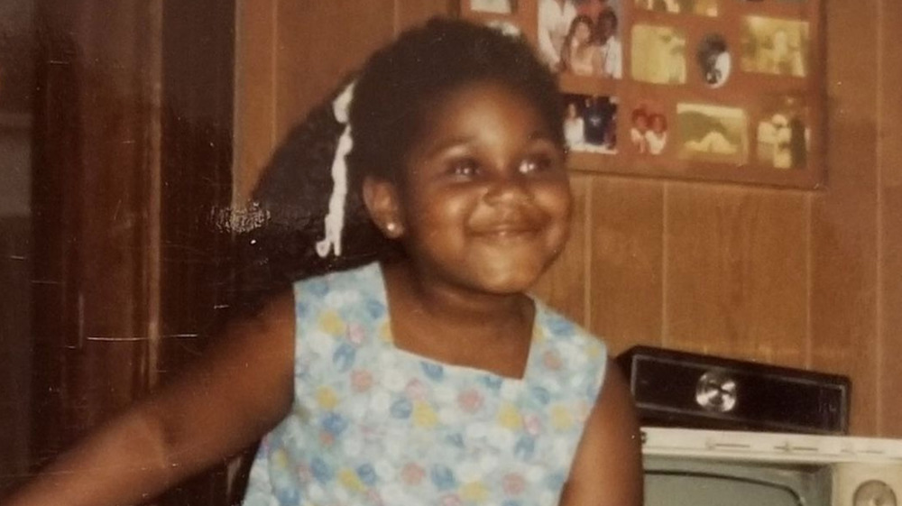 Young Gabourey Sidibe smiling