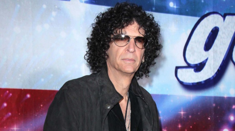 Howard Stern in dark suede coat