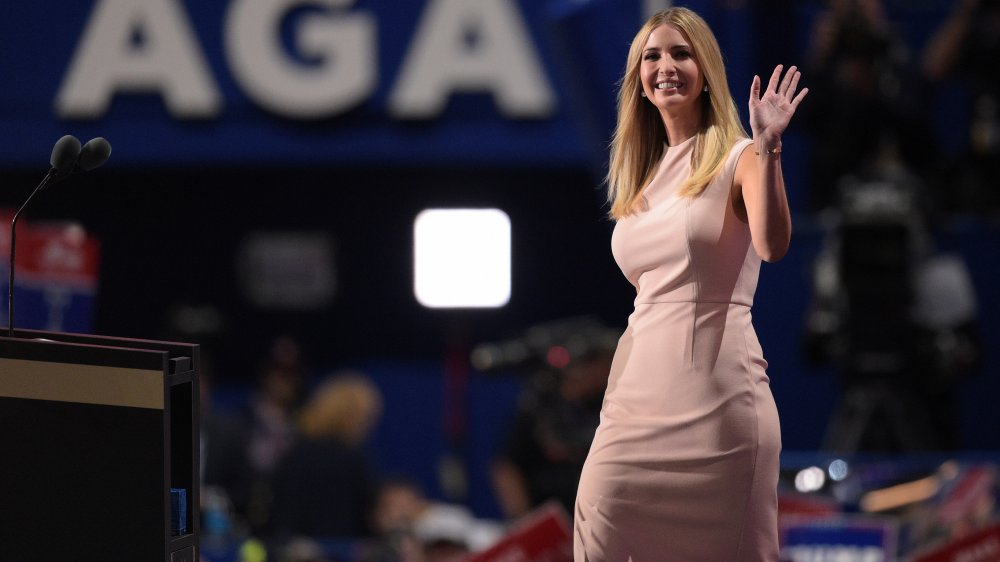 Ivanka Trump in a pink dress, smiling and waving at the 2016 RNC