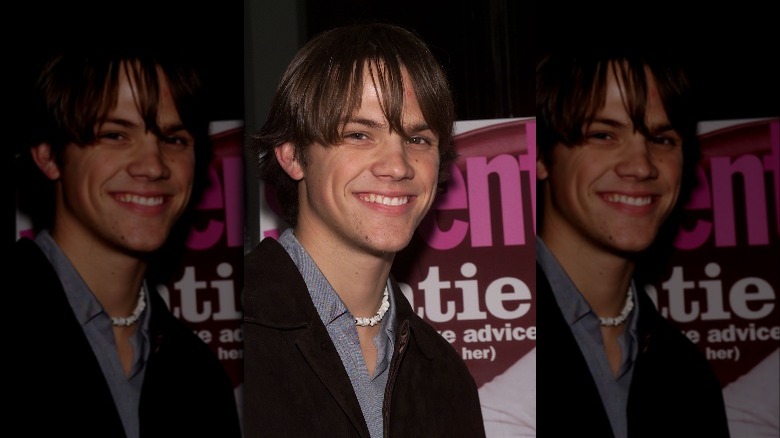 Jared Padalecki smiling at an event in 2002