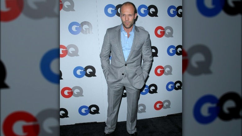 Jason Statham in grey suit with a light blue shirt