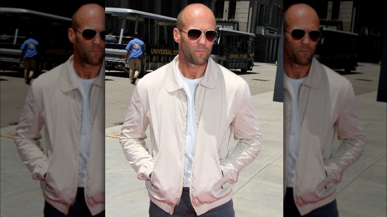 Jason Statham in a casual jacket and aviator sunglasses