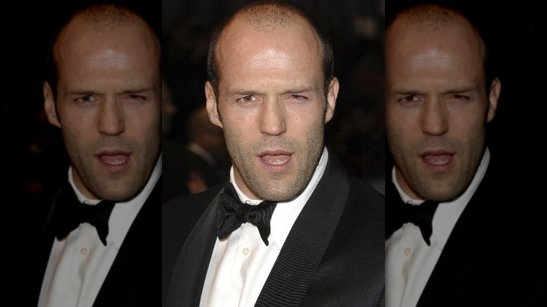 Jason Statham pulling a funny face in a tuxedo 