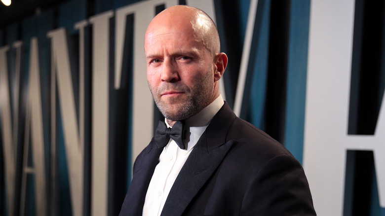 Jason Statham posing in tux