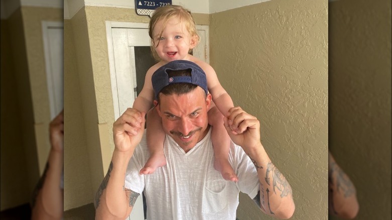 Jax Taylor with his son on his shoulders