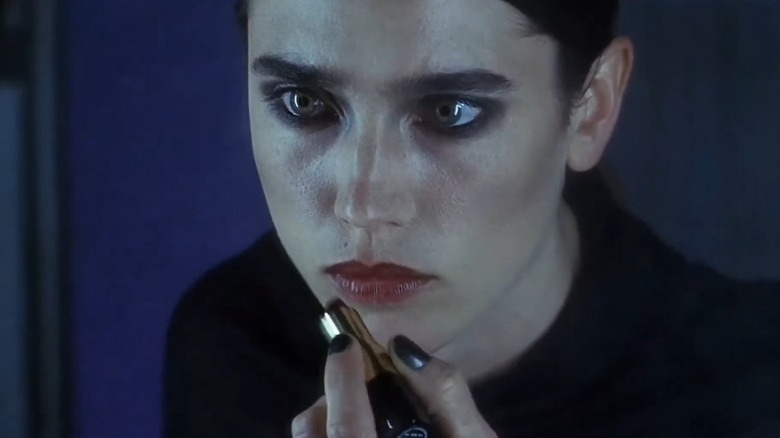 Jennifer Connelly applies lipstick